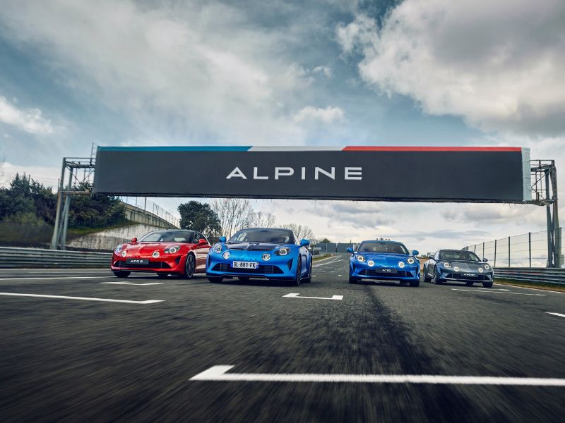 whole range of Alpine A110 driving on a race track