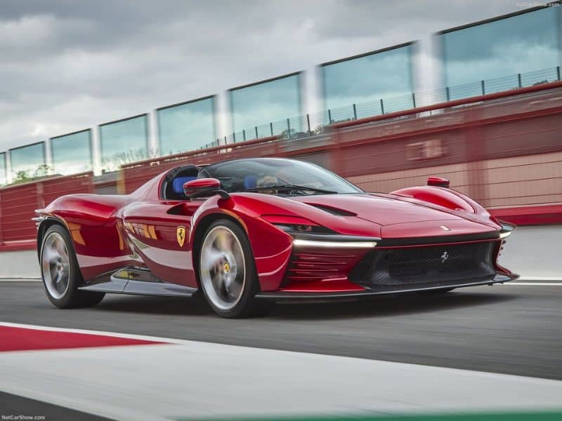 2022 red Ferrari Daytona SP3 driving on a race track