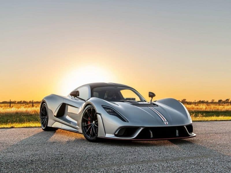 2023 silver hennessey f5 on the road with the sun setting