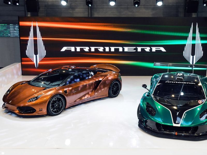 2017 orange and green Arrinera Hussarya GT and GT3 being showcased at a car show